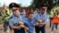 Kazakhstan - A woman reacts as law enforcement officers detain a man during a protest rally held by Kazakh opposition supporters in Almaty, Kazakhstan July 6, 2019. REUTERS/Pavel Mikheyev
