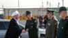 A handout picture provided by the Iranian presidency on September 22, 2019 shows (L to R) President Hassan Rouhani shaking hands with Iranian military leaders.