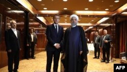 France's president Emmanuel Macron (L) greets Iranian president Hassan Rouhani at the Millennium Hotel near the United Nations on September 18, 2017, in New York. File photo