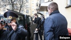 Police seize equipment from the Belsat TV station in Minsk on March 31. 