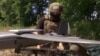 A Ukrainian soldier uses Starlink satellite Internet services to connect to a drone near the front line. (file photo)