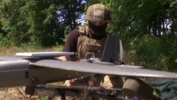 A Ukrainian soldier uses Starlink satellite Internet services to connect to a drone near the front line. (file photo)