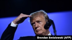 BELGIUM -- U.S. President Donald Trump gestures as he addresses a press conference on the second day of the NATO summit in Brussels, July 12, 2018