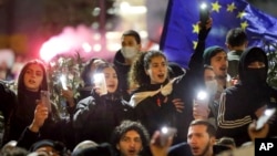 Protesters in Tbilisi take part in a rally against the "foreign agent" law in March. 