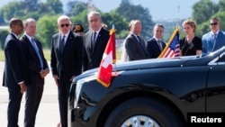 U.S. President Joe Biden, Swiss Federal President Guy Parmelin, and delegation members gather after Biden's arrival at the airport in Geneva, Switzerland, on June 15.
