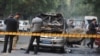 Investigators work at the site where a vehicle exploded near the Israeli Embassy in New Delhi.