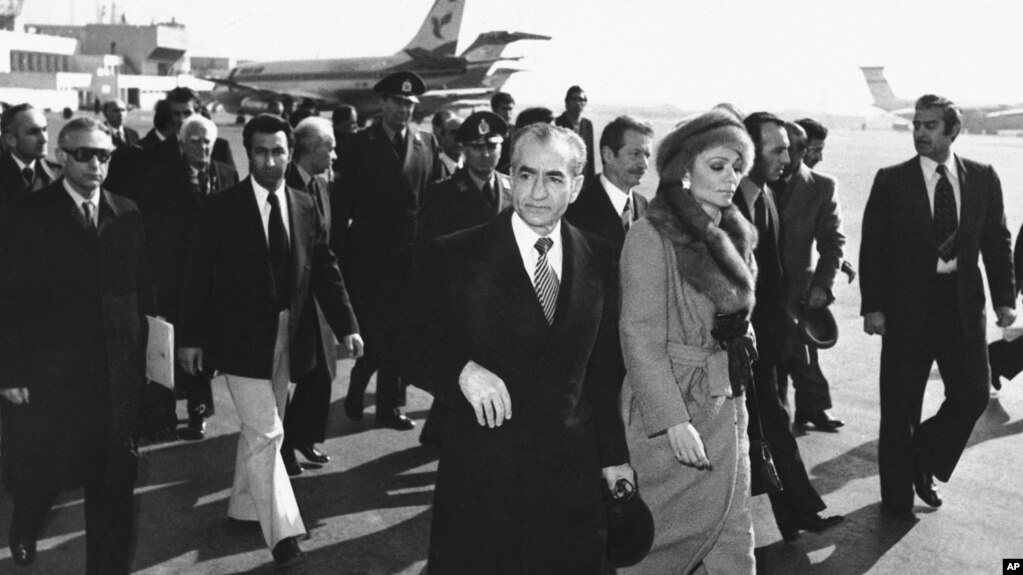FILE - In this Jan. 16, 1979 file picture, Shah Mohammad Reza Pahlavi and Empress Farah walk on the tarmac at Mehrabad Airport in Tehran to board a plane to leave Iran.