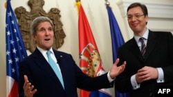 U.S. Secretary of State John Kerry (left) with Serbian Prime Minister Aleksandar Vucic at an OSCE event in Belgrade, on December 2. 