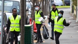 Čistači na ulicama Melburna tokom pandemije jula 2020.