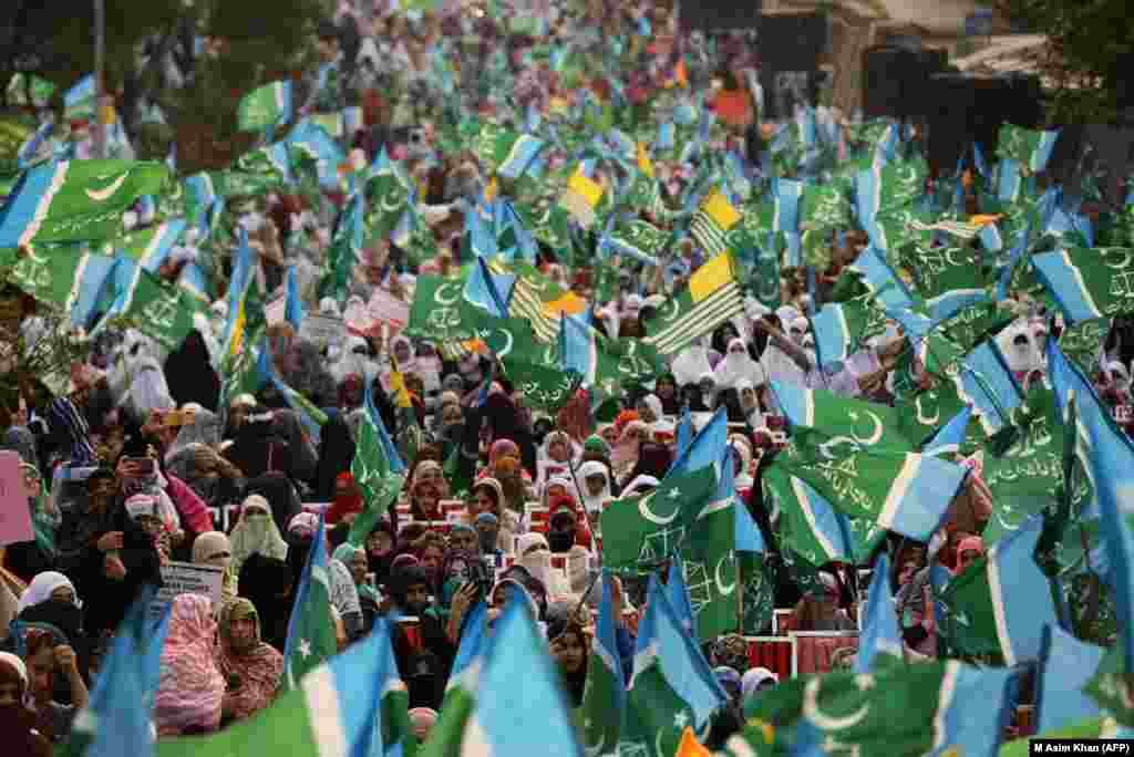 Female supporters of the Pakistani Islamist party Jammat-e-Islami march during a protest in solidarity with Indian Kashmiri Muslims in Islamabad on October 16. (AFP/M Asim Khan)