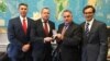 U.S. Representative Chris Smith (2nd right) receives an award from Belarusian opposition activists in May 2019.
