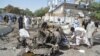 Pakistani security officials inspect the scene of a blast near the inspector-general of police office in Quetta on June 23.