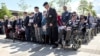 British veterans observe two minutes of silence at an event to commemorate the 75th anniversary of D-Day in Alrewas, Staffordshire, Britain, in 2019.