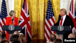 U.S. President Donald Trump and British Prime Minister Theresa May speak during a press conference at the White House on January 27.