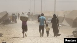 Syrian refugees arrive at the Al Zaatri refugee camp in the Jordanian city of Mafraq late last month. 