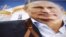 Владимир Путин, церковь, георгиевская ленточка – идеологические символы российского влияния, пропагандируемые Москвой.