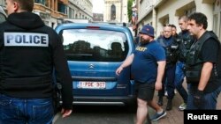 A Russian soccer fan is detained by police in Lille on June 15.
