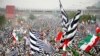 Supporters of opposition political parties wave party flags in Islamabad on November 1.