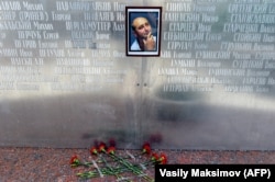 Flowers lay under a picture of Babchenko on the memorial wall of Russia's Union of Journalists in Moscow on May 30.