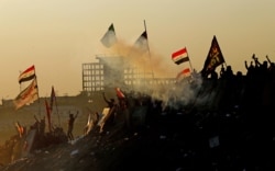 Iraqi demonstrators at an anti-government protest in Baghdad, November 1, 2019