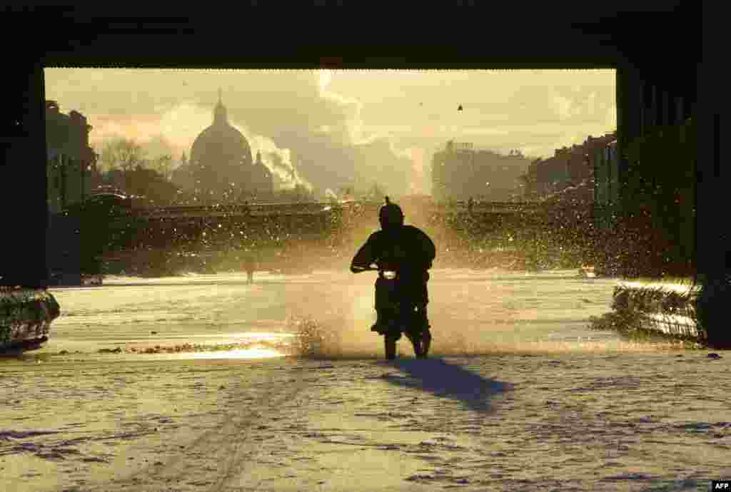 A biker rides on the frozen Fontanka River in central St. Petersburg, Russia. (AFP/Olga Maltseva)