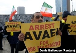 People demonstrate against the speech of Avaei, in front of the United Nations in Geneva, February 27, 2018