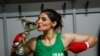 Iranian boxer Sadaf Khadem poses in the locker room after winning the fight against French boxer Anne Chauvin during an official boxing bout in Royan, France, April 13, 2019.