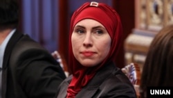 Амина Окуева, уроженка Чечни, жена Адама Осмаева, обвиненного в покушении на Путина.