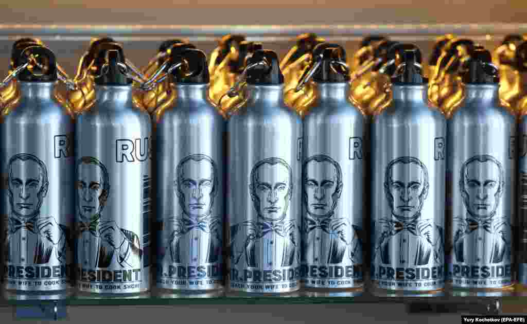 Water bottles bearing portraits of Russian President Vladimir Putin were on sale during the anniversary ceremony of the Panorama-360 viewing platform on the 89th floor of the Federation Tower in Moscow on April 17. (epa-EFE/Yuri Kochetkov)