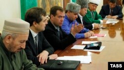 Akhmad-hadji Abdulayev is seen here on the left with then-Russian President Dmitry Medvedev in 2011.