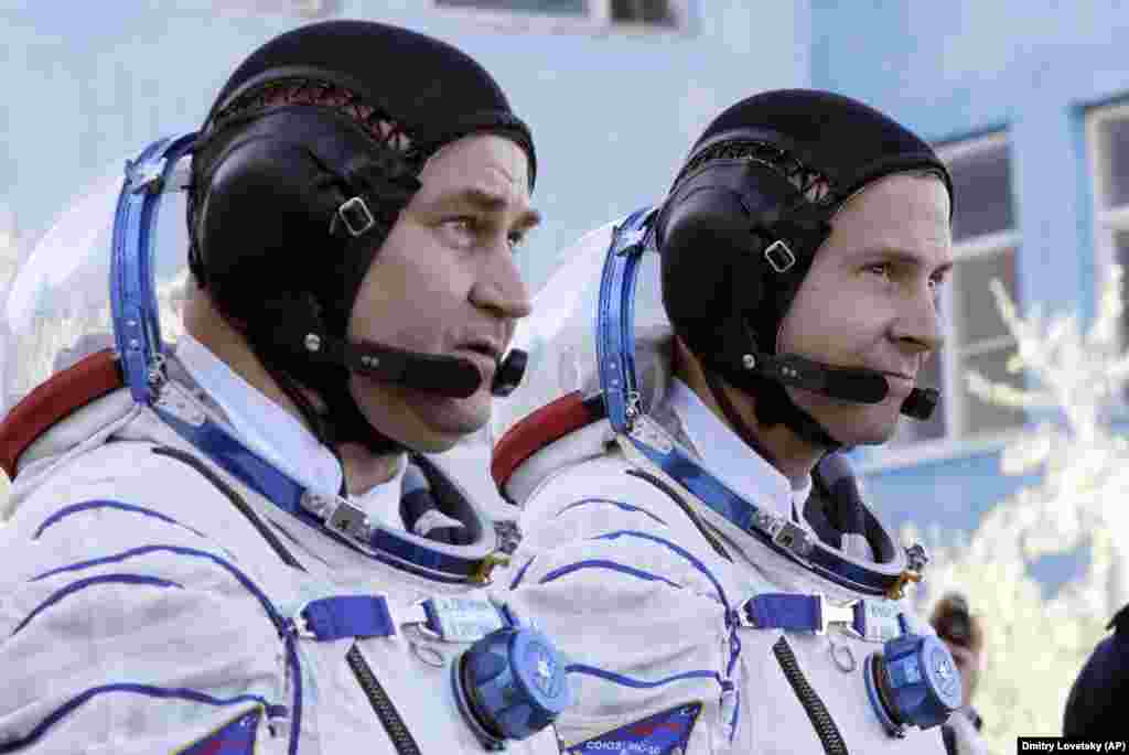 U.S. astronaut Nick Hague (right) and Russian cosmonaut Aleksei Ovchinin prior to launch