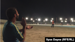 Afghanistan -- Players and spectators enjoy a nighttime cricket match in Lashkar Gah’s Wazir Akbar Khan stadium.
