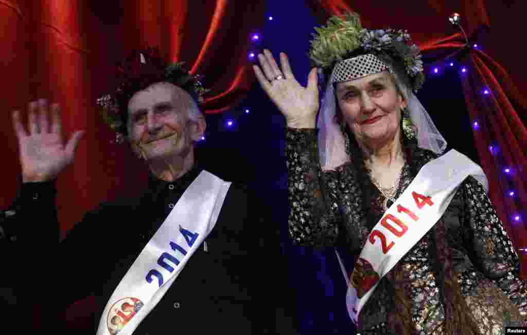 Super Grandfather Vladimer Zangurashvili, 70, and Super Grandmother Lira Arabuli, 74, wave to the audience after being crowned.