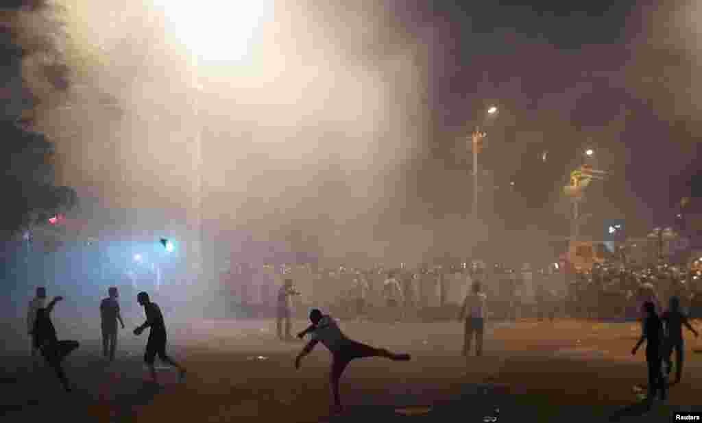 Armenia - Demonstrators who had gathered in a show of support for gunmen holding several hostages in a police station, clash with riot police in Yerevan, Armenia, July 20, 2016