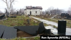 A Serbian Orthodox cemetery on a hill to the south of the Ibar River in Mitrovica lies devastated, with hundreds of headstones in shards and the chapel at its center desecrated and burned.