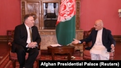 Afghan President Ashraf Ghani (right) meets with U.S. Secretary of State Mike Pompeo in Kabul on March 23.