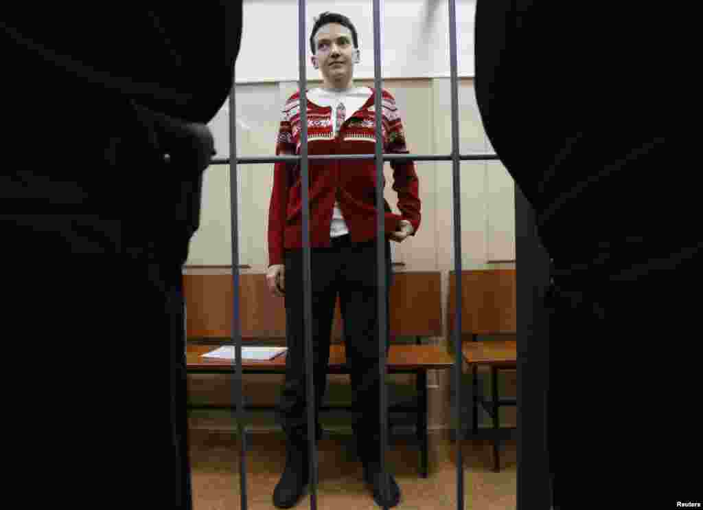 Imprisoned Ukrainian military pilot Nadia Savchenko stands inside a defendants' cage as she attends a court hearing in Moscow on March 4. She has been on a hunger strike since December 13. Savchenko was captured by pro-Russian forces and handed over eight months ago to Russia, where she was imprisoned on charges of aiding in the killing of two Russian journalists in eastern Ukraine. At home, she has become a symbol of resistance to Russian aggression. (Reuters/Maxim Zmeyev)