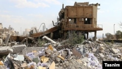 A building near Damascus lies in rubble after the attack.