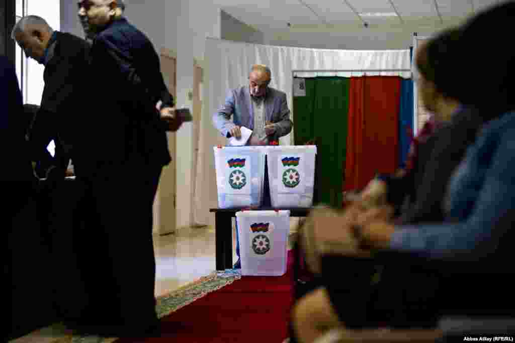 A man casts his ballot during the presidential election in Baku.