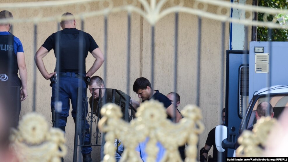 A photo of some of the Tornado detainees, taken outside Kyiv's Obolon district court in August 2016. Twelve Tornado members are now on trial behind closed doors.