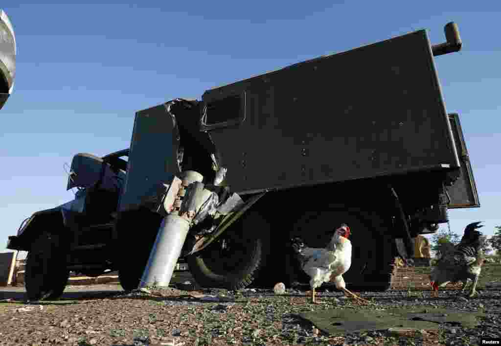 A Ukrainian military vehicle damaged by an unexploded rocket shell is seen at the site of recent shelling near the village of Dmytrivka in eastern Ukraine. (Reuters/David Mdzinarishvili) 