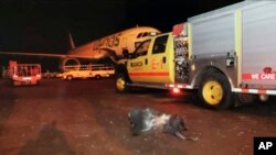 This photograph released by the state-run Saudi Press Agency shows debris on the tarmac of Abha Regional Airport after an attack by Yemen's Houthi rebels in Abha, Saudi Arabia, Wednesday, June 12, 2019. (Saudi Press Agency via AP)