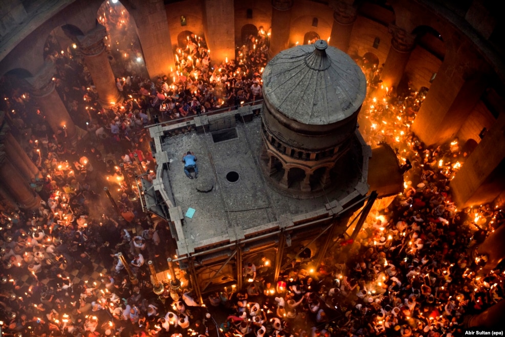 For Abir Sultan, local contacts were key to this image of Jerusalem's annual Miracle of the Holy Fire. "I know the deputy patriarch very well so I asked him if I could go up the top, looking down at the ceremony," the epa photographer says. When a man climbed onto the roof of Jesus's tomb during the Orthodox Christian ritual, Sultan knew he had that "little something different." "He dropped onto the ground almost like a Muslim praying," he recalls. "It was just for a second." As Sultan worked, some nuns stood next to him holding unlit candles. "In the ceremony the people are hoping for God's light to reach them -- when your candle catches fire it's like a blessing. These nuns were standing up there with me, 30 meters above the flames. There is really no chance their candles will light, but every time I shoot this ceremony they're there, waiting for God's blessing."