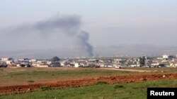 Smoke rises during clashes between Kurdish peshmerga fighters and Islamic State (IS) militants, on the outskirts of Mosul, in late January.