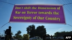 A banner, hung by demonstrating students, is seen near the U.S. consulate in Peshawar in late November.