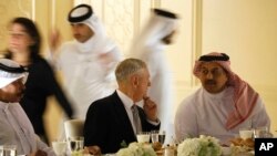 Qatar's Minister of Defense Khalid bin Mohammad Al-Attiyah, right, welcomes U.S. Defense Secretary James Mattis at his residence in Doha, Qatar, Saturday April 22, 2017. (Jonathan Ernst/Pool via AP)