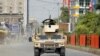 An Afghan Army vehicle patrols near the site of an attack on a jail compound in the eastern city of Jalalabad.