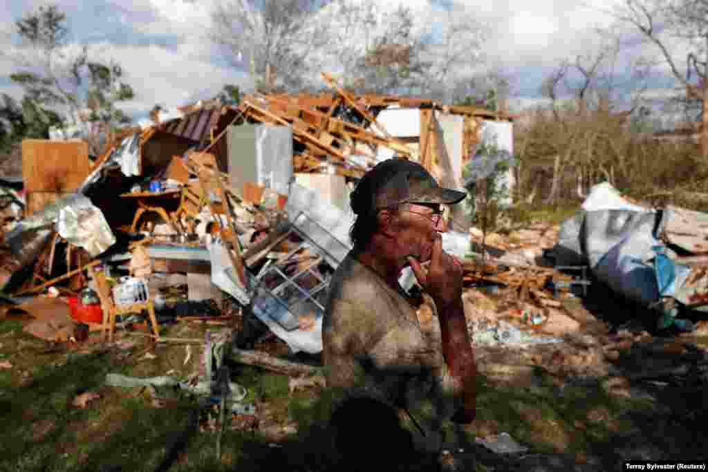 Bernard Sutton, 64, walks past the remains of his home, destroyed by Hurricane Michael in Fountain, Florida. (Reuters/Terray Sylvester)