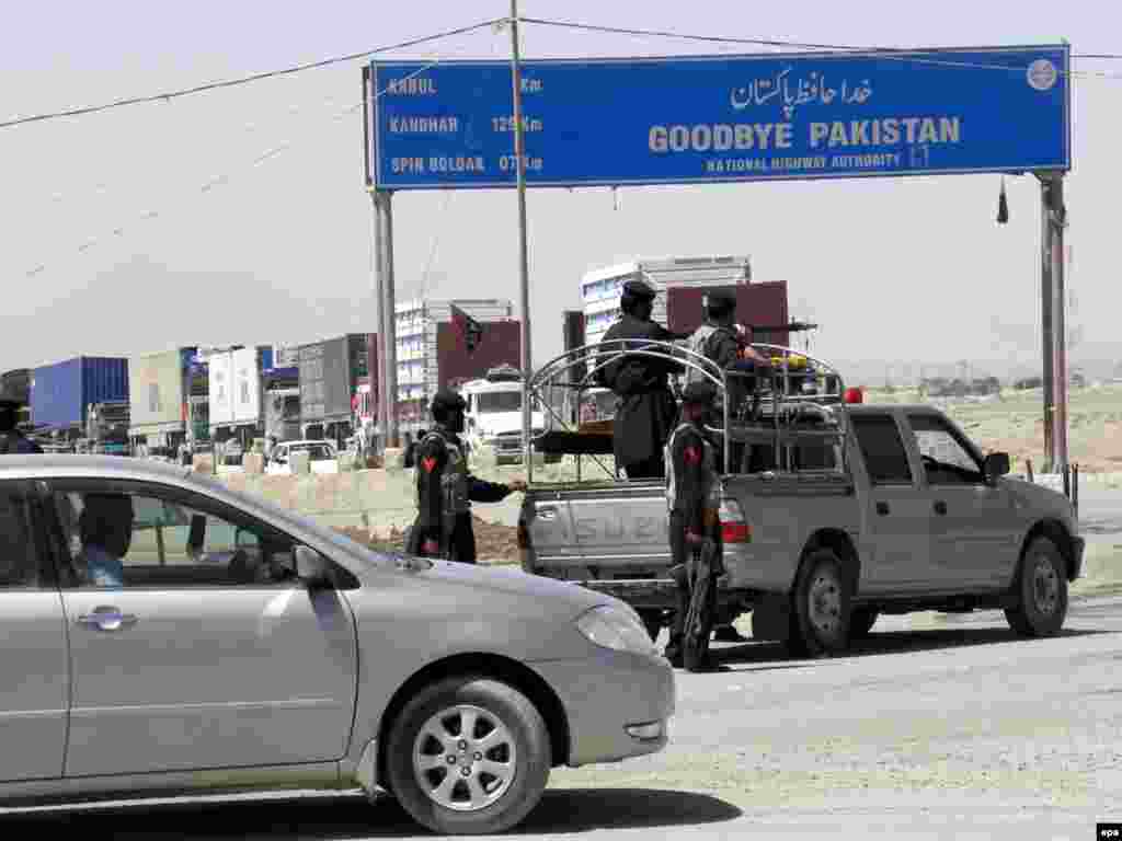 Pakistani paramilitary troops stand guard as trucks carrying NATO supplies await clearance in Chaman in 2009.