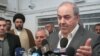 Iyad Allawi speaks to the press in Najaf.